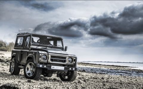 Custom Defender on rocky shore