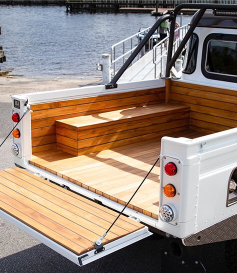 Custom defender 110 truck bed with teak wood
