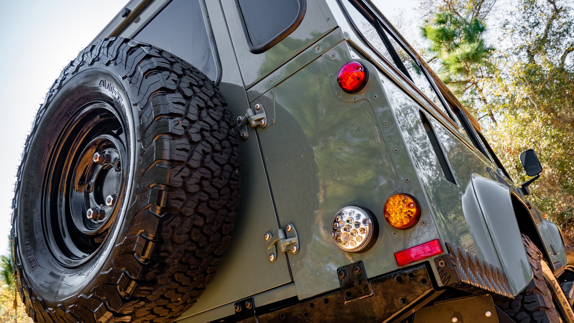 Back of a classic defender truck with the wheel on the back