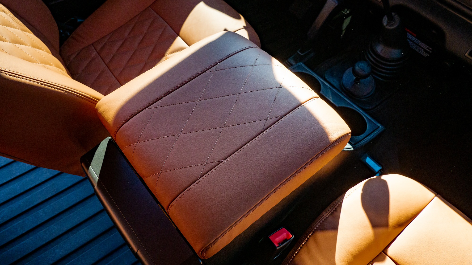 Leather finishings on the center console of a classic defender land rover