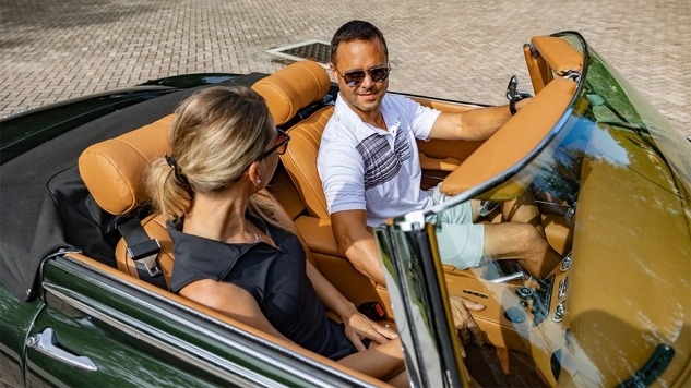 Project Dallas Custom Jaguar convertible with man and woman in the car