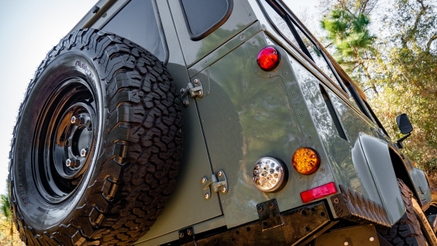 Back of a classic defender truck with the wheel on the back