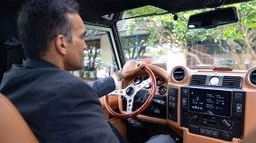 Project Ranulf custom land rover being driven by a man